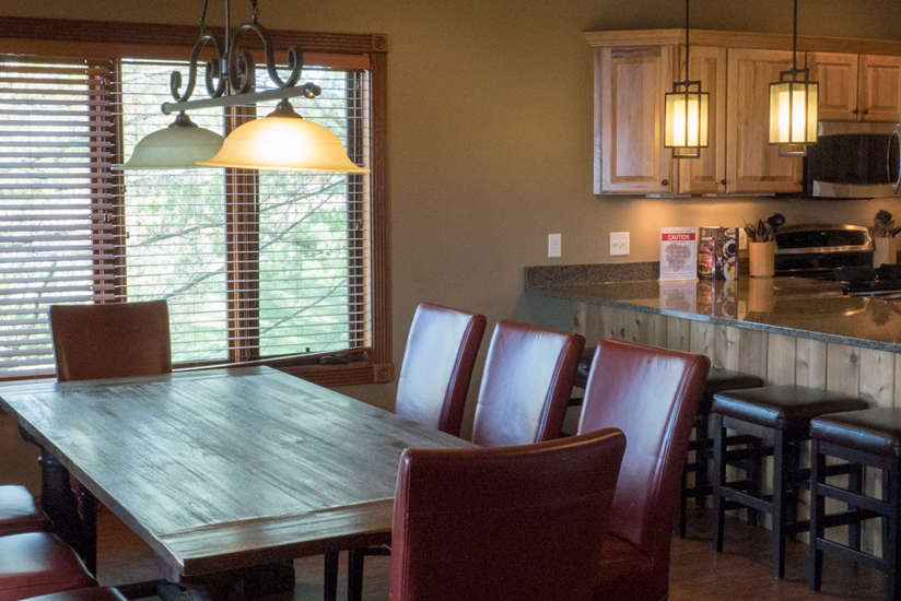 an overview of the Waterfront Retreat's dining room and kitchen area