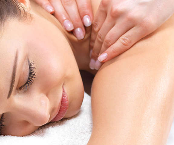 woman getting a back massage in the spa