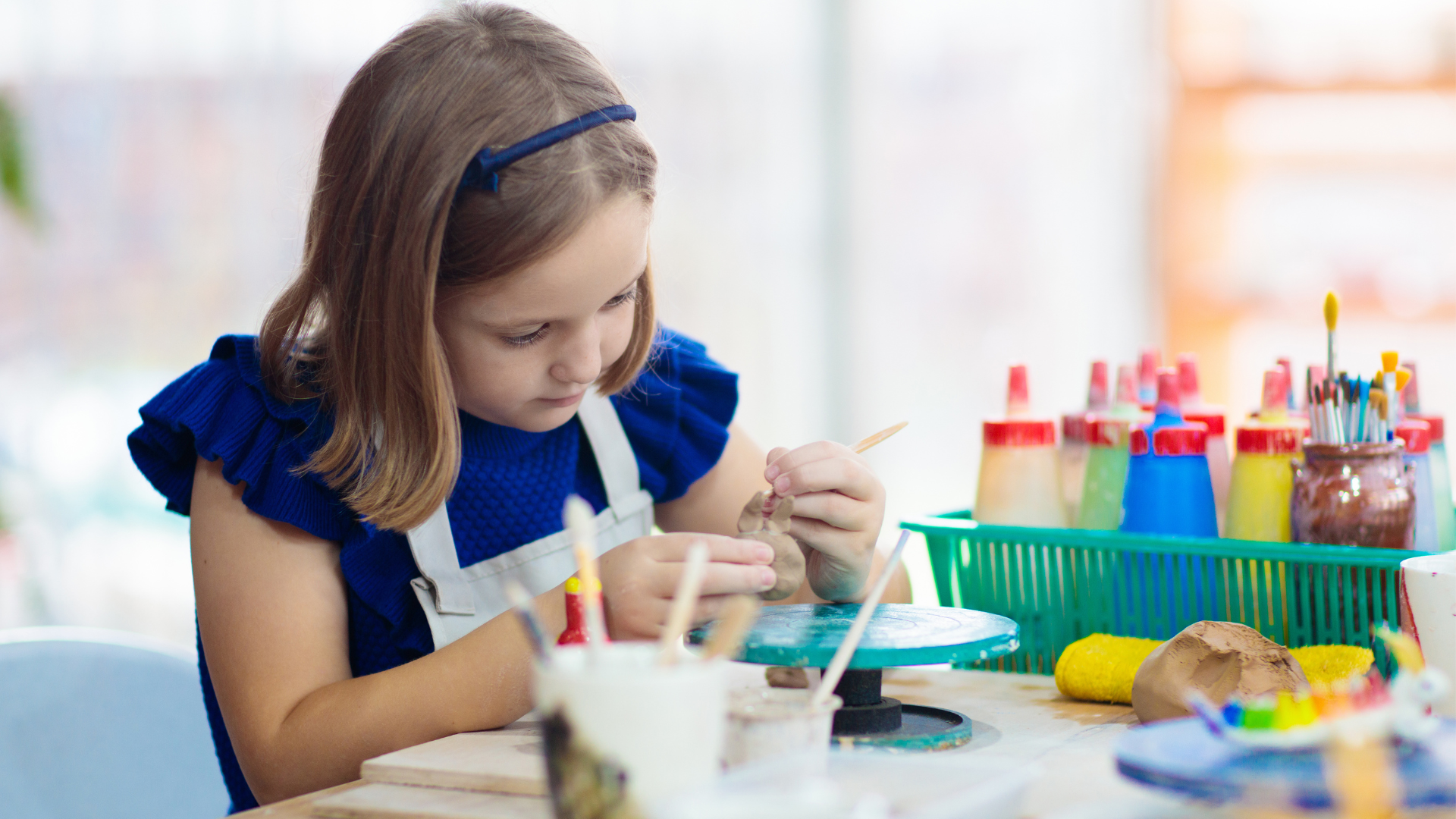 girl painting pots