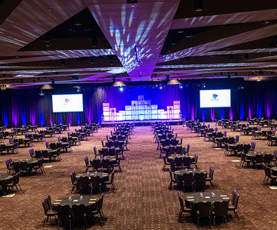 an overview of the new conventions center with purple lighting