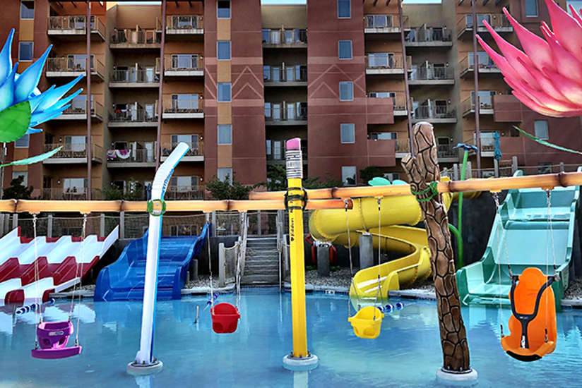 bugs burrow kids area in the outdoor pool area. Filled with waterslides, giant bug statues, and kids having a blast!