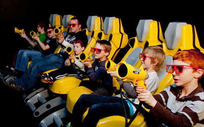 Father and a group of boys plays 3D video game