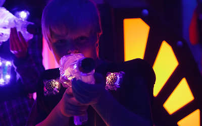little boy playing laser tag