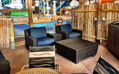 Overview of the monsoon cabana. Includes table, chairs, tv, and a couch.