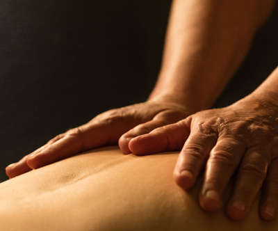 Person receiving a massage on their upper back at Spa Kalahari
