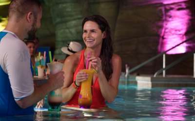 Couple enjoying a Monster Cocktail in the Grotto Swimup Bar