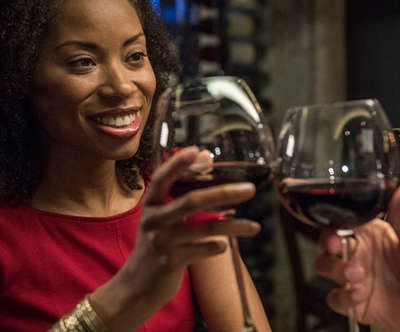 Husband and wife are toasting with wine.