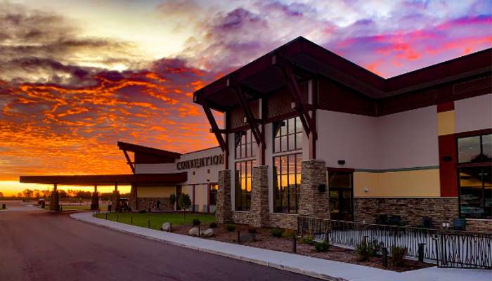 Exterior image of the Kalahari Convention Center with a illuminating sunset in the background.