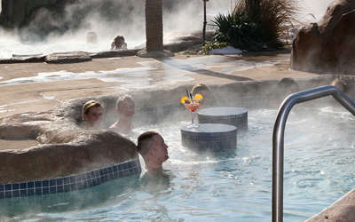 adults enjoying the hot tub