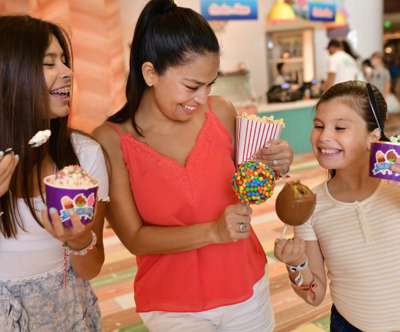 A mother and two daughters happily enjoying their desserts from Last Bite.