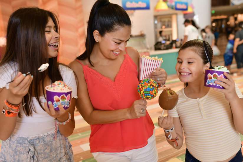 A mother and two daughters happily enjoying their desserts from Last Bite.