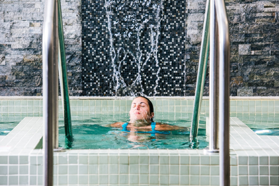 A woman enjoying herself at Spa Kalahari.