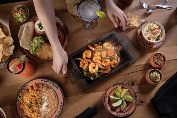 Table full of delicious modern Mexican cuisine at Cinco Niños