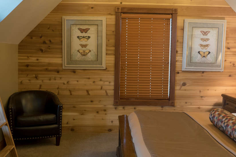 an overview of the Waterfront Retreat's bedroom with bunk beds and regular bed