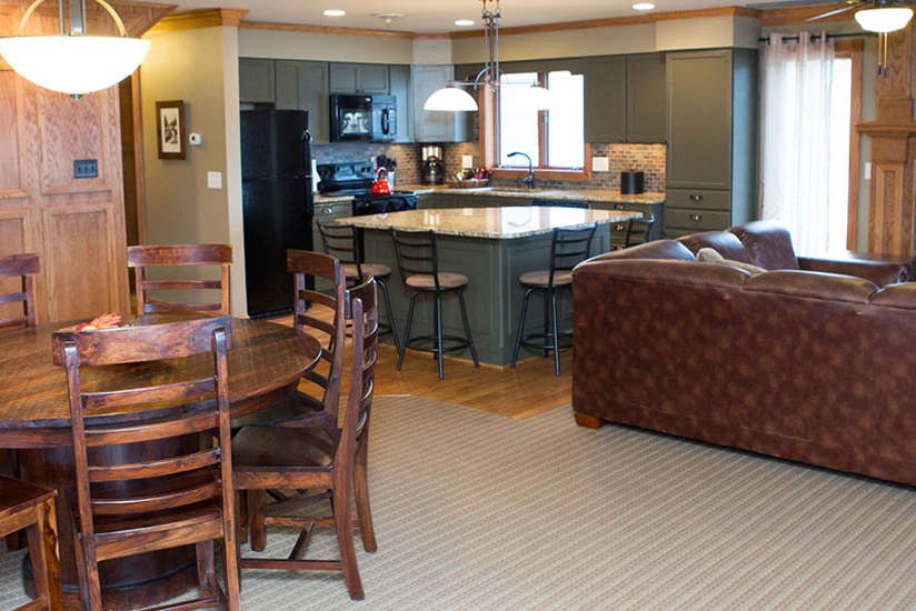 kitchen, dining room, and living room of the Homestead cabin at Lake Delton Waterfront Villas