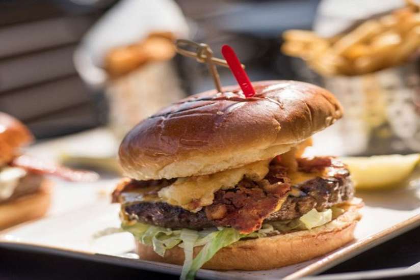 a burger and fries from B-Lux Grill and Bar
