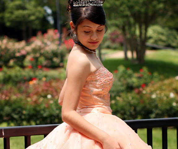 a girl dressed as a princess for her quinceaneras