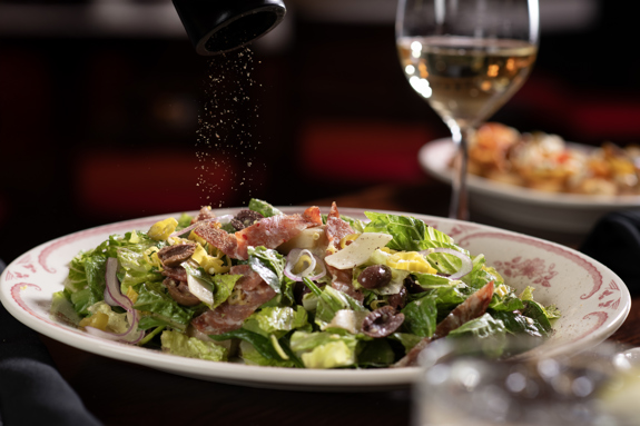 ANTIPASTO- Romaine, spinach, provolone, salami, artichokes, olives, red onion, pepperoncini,  red wine vinaigrette