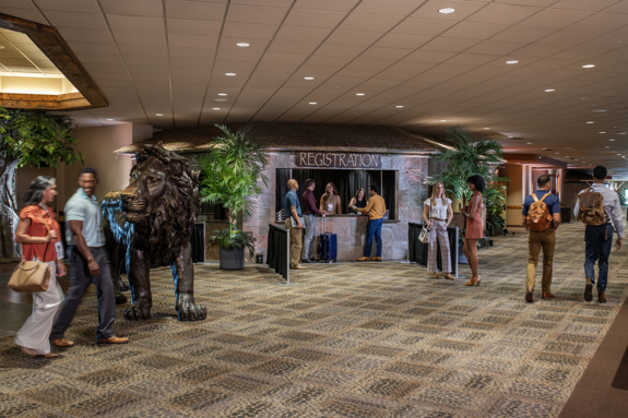 People in conference check in area