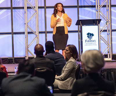a speaker giving a presentation inside the new conventions center