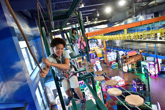 Boy conquering the ropes course