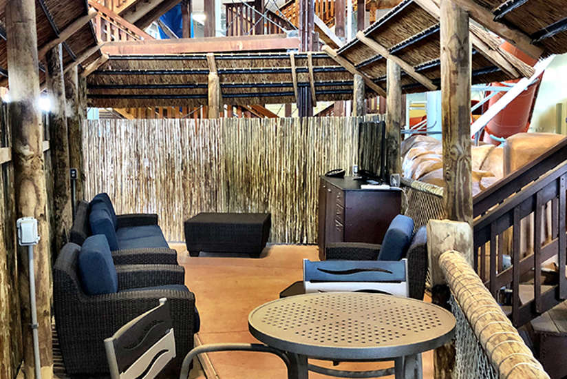 an overview of the madagascar cabana. It includes a tv, chairs, couch, and tables. an overview of the madagascar cabana. It includes a tv, chairs, couch, and tables.