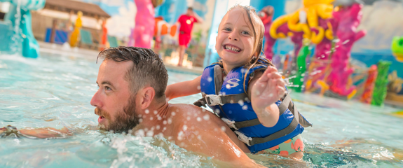 Dad with Daughter in kiddy pool