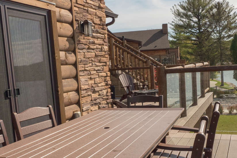 an overview of the Waterfront Retreat's porch with dining table on it