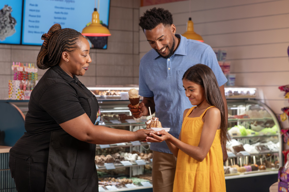 employee giving an Ice Cream dish