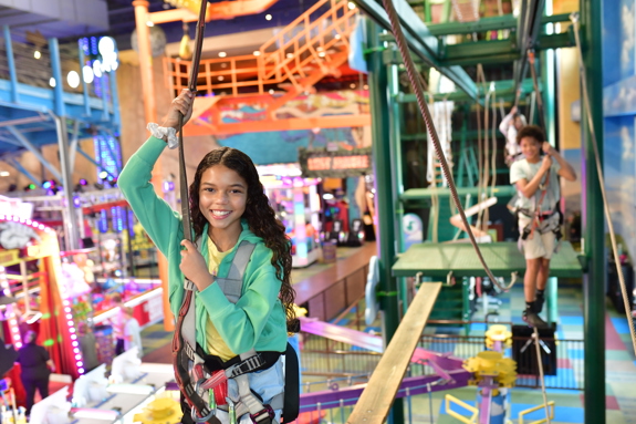 Girl walking the high ropes course