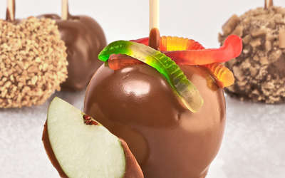 a caramel apple with gummy worms from Candy Hut
