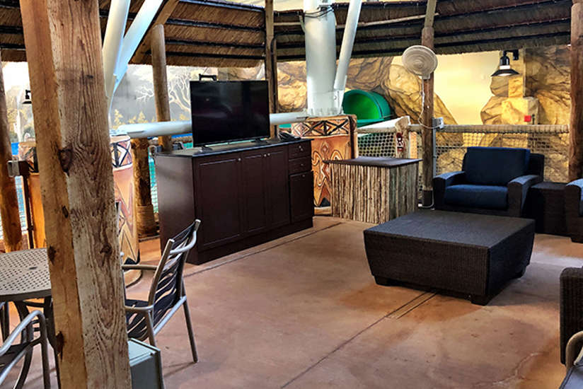 Overview of the Riverview cabana. Includes table, chairs, tv, and a couch. It's by the lazy river. Overview of the Riverview cabana. Includes table, chairs, tv, and a couch. It's by the lazy river.