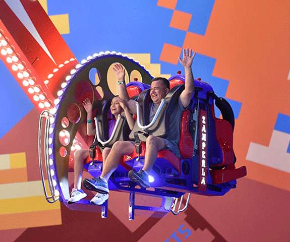 Father and Daughter riding the Red, White and Woo in the Tom Foolerys Adventure Park