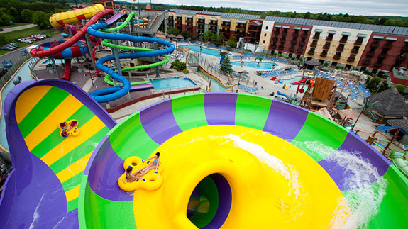 two girls descending on a water slide