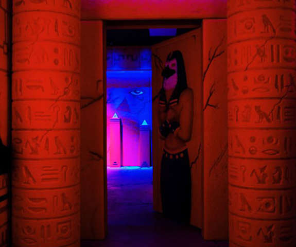The hallway inside our Egyptian themed escape room with pillars covered in hieroglyphics.