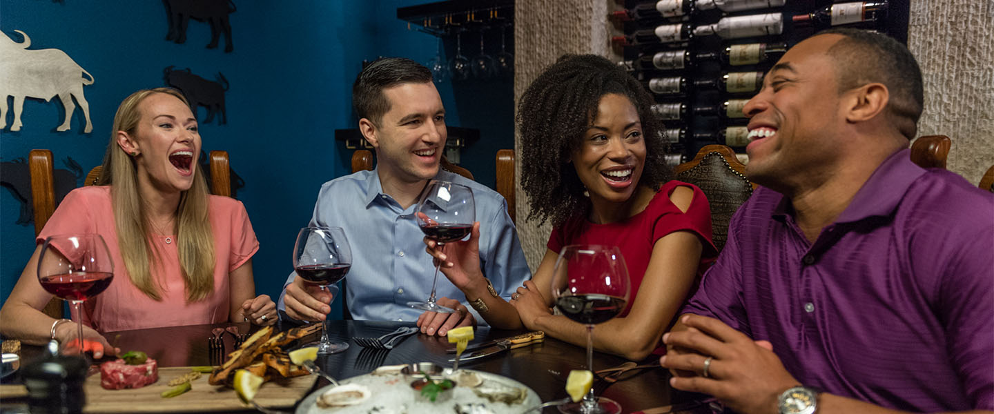 Friends enjoying a glass of wine at kalahari