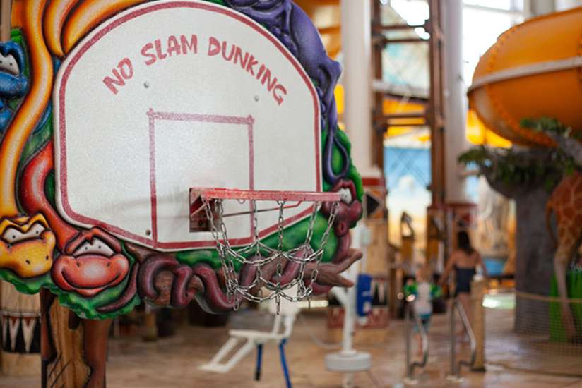 The basketball hoop at one of the indoor water park pools.
