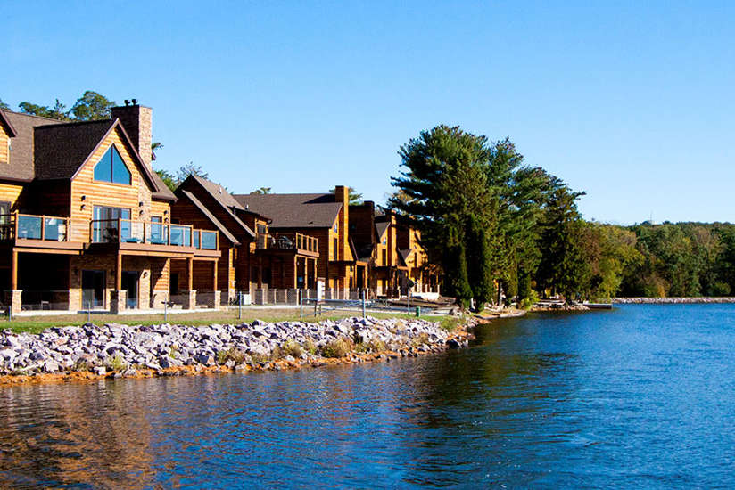 an overview of the Cottage's exterior with lake