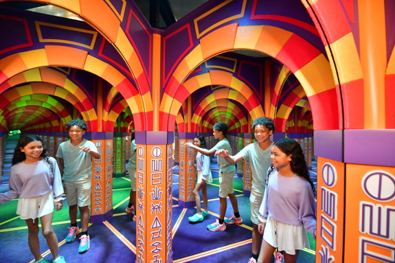 boy and girl walking through Cave of Mirrors