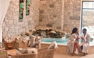 Couple enjoying the indoor day spa lounge area at Spa Kalahari