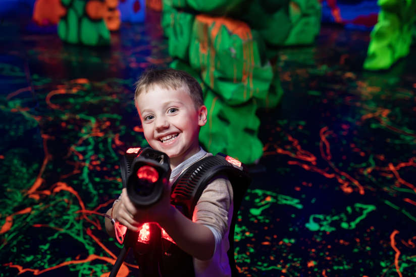 Boy playing laser tag