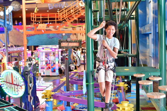 Boy conquering the ropes course