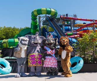 Kalahari characters posing in front of waterslides
