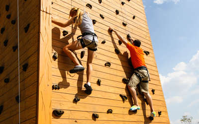 couple kids rock climbing in the Safari Outdoor Adventure Park in Ohio