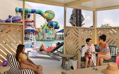 Family enjoying an outdoor bungalow rental.