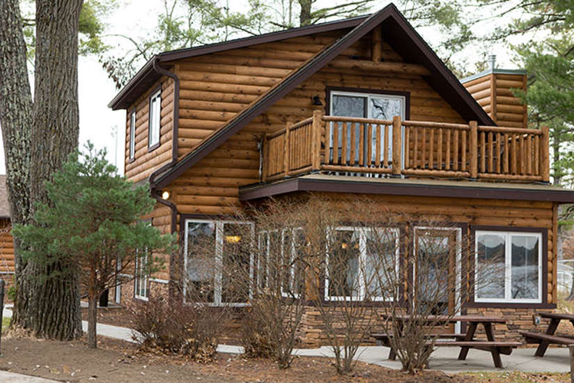 Lake Delton Waterfront Cabin with two picnic tables outside