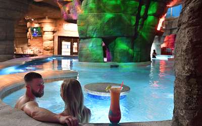 Couple Enjoying a Drink at the Grotto Swimup Bar