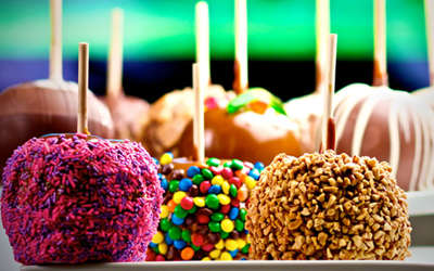 an assortment of delicious caramel and candy apples