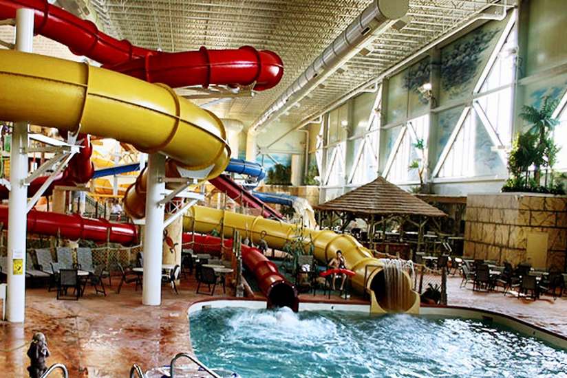 two water slides leading into a pool