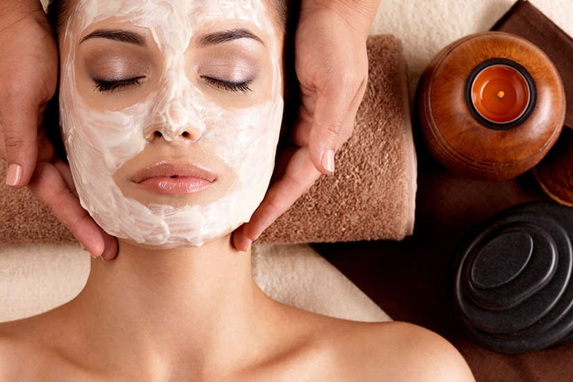 woman getting a facial in the spa woman getting a facial in the spa